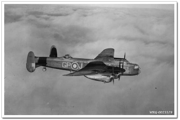 Avro Lancaster B Mark I, W4113 GP-J, of No. 1661 Heavy Conversion Unit based at Winthorpe, Nottinghamshire, in flight. W4113 was a veteran aircraft having flown on a number of raids with Nos. 49 and 156 Squadrons RAF in 1942 and 1943.