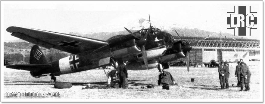 Junkers Ju 88A having a tire changed, Sicily, 1942.